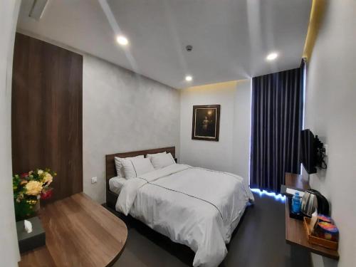 Ліжко або ліжка в номері Mia Hotel Ninh Thuận