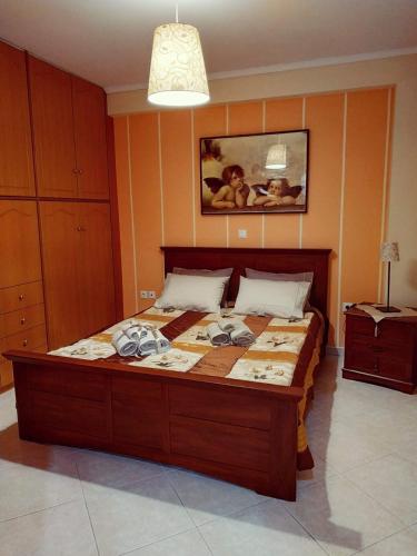 a bedroom with a large bed in a room at Central Moudros apartments in Moudhros