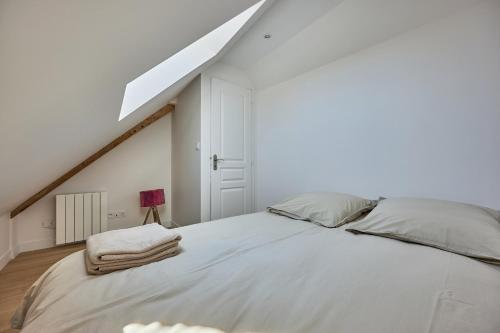 Postel nebo postele na pokoji v ubytování Maison Andrias - Charmante maison de bourg