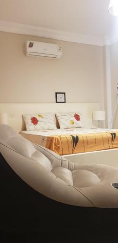 a bed in a room with a bed frame in a room at LA vista topaz in Ain Sokhna