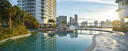 a swimming pool with a view of a city at Macrolink Medini Legoland by Stayrene in Kangkar Pendas