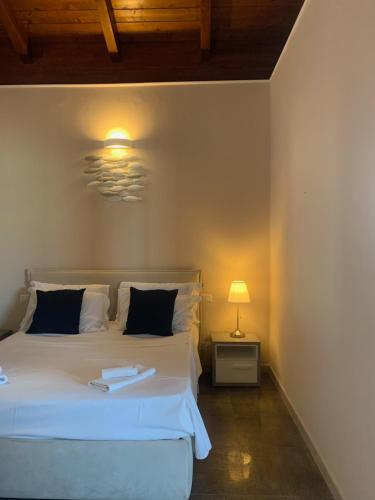 Tempat tidur dalam kamar di Spiaggia Le Dune Residence