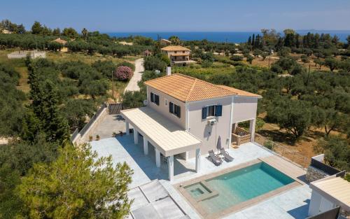 an aerial view of a house with a swimming pool at Le Mar Villa in Vasilikos