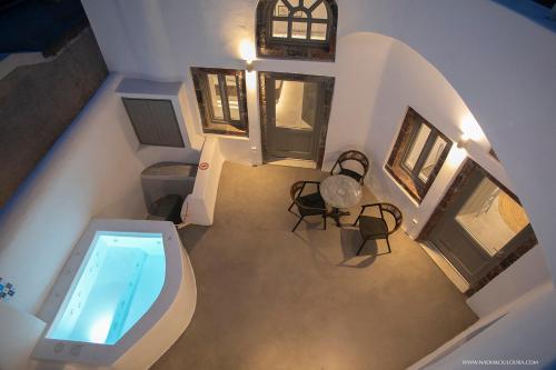 an overhead view of a room with a swimming pool at AnnaFani Villa in Pirgos