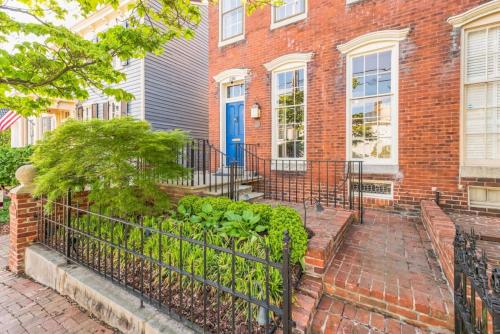 a brick house with a blue door at Historic Petersburg Row Home in Petersburg