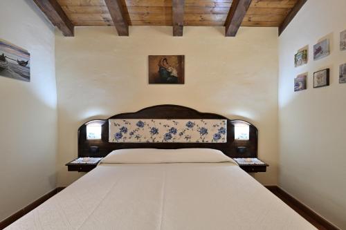 En eller flere senge i et værelse på Casa vacanze a Tortolì
