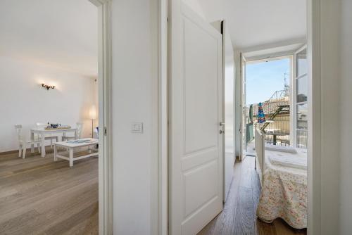 a white door leading to a room with a balcony at Casa Mare in Levanto