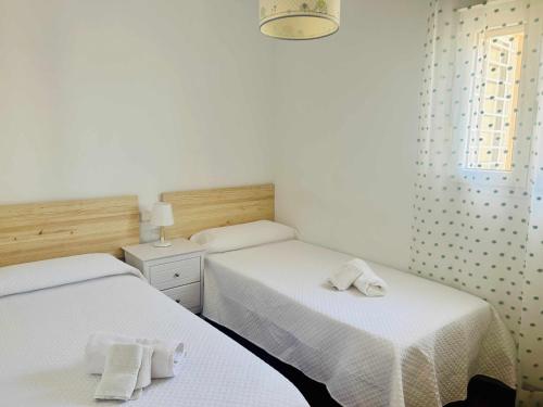 Postel nebo postele na pokoji v ubytování Casa Playa Roquetas