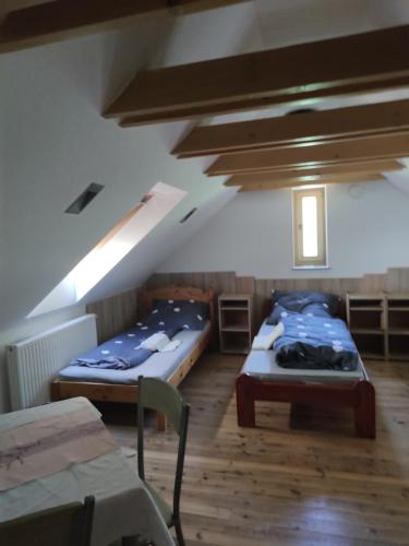 Postel nebo postele na pokoji v ubytování Malomkerék Vendégház