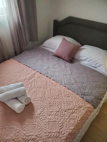 Postel nebo postele na pokoji v ubytování Apartmani Liki