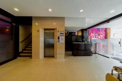 a lobby of a building with a elevator at Ranas Residency in Tiruchchirāppalli