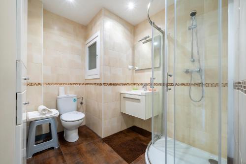 a bathroom with a shower and a toilet and a sink at Cap Salou in Salou