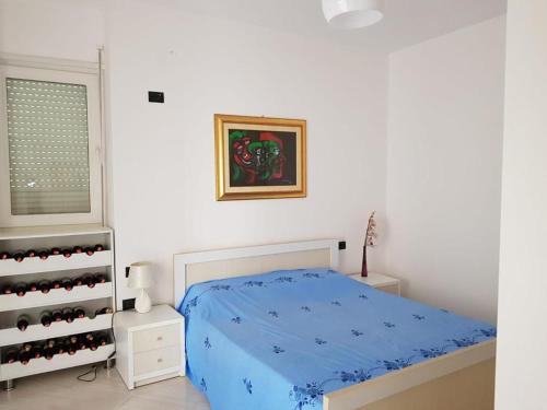 a bedroom with a bed and a wine rack at Sea retreat apartment in Himare