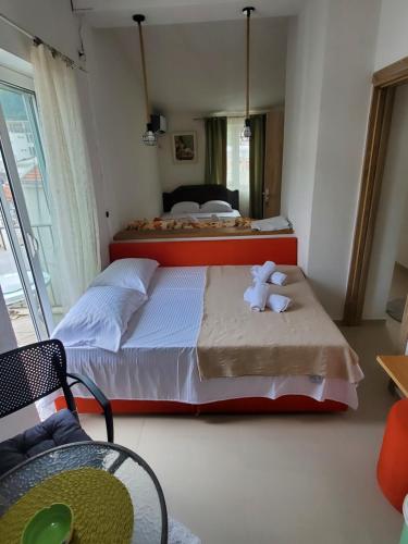 Postel nebo postele na pokoji v ubytování Apartmani Liki