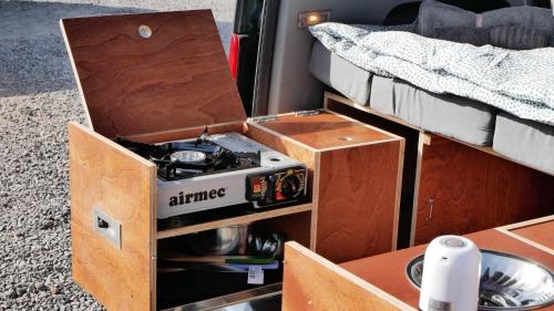 an open drawer in a bed in a van at EndlessCamperVan in San Miguel de Abona