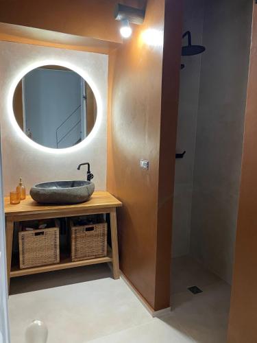 a bathroom with a sink and a mirror at Casa Noal in Nardò