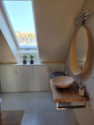 a bathroom with a sink and a mirror at Zámek na dlani Mikulov in Mikulov