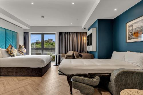 Voodi või voodid majutusasutuse Roomzzz Edinburgh toas