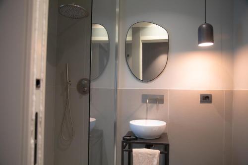 a bathroom with a sink and a mirror at The Sanctuary Urban Retreat in Rome