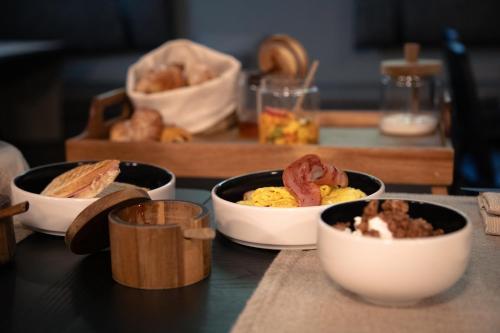 a table topped with bowls of food on a counter at The Sanctuary Urban Retreat in Rome