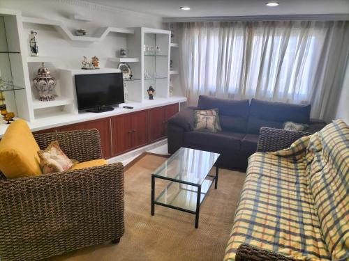 Телевизор и/или развлекательный центр в Casa de vacaciones en Vigo