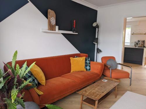 a living room with a couch and a table at Spacious Unique Brighton Home FREE Parking in Brighton & Hove