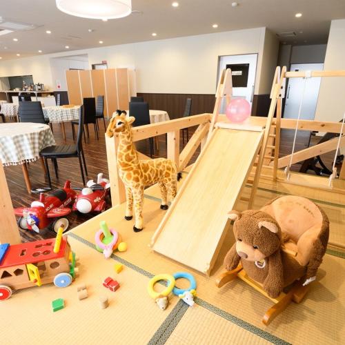 a bunch of toys on the floor in a room at 阪南国际HOTEL in Hannan