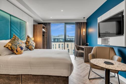 Voodi või voodid majutusasutuse Roomzzz Edinburgh toas
