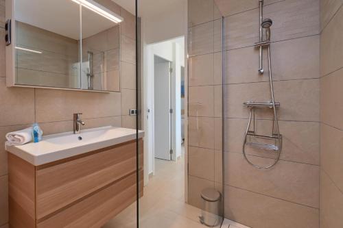 a bathroom with a sink and a shower at Mercedes in Jávea
