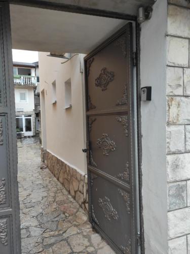 an open door to a building with a stone walkway at Apartments Golden Bridge in Mostar