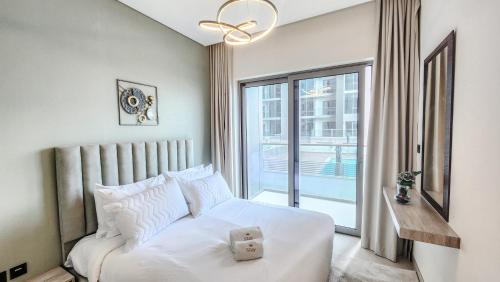 Postel nebo postele na pokoji v ubytování STAY BY LATINEM Luxury 1BR Holiday Home CVR B204 near Burj Khalifa