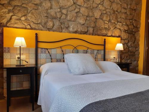 מיטה או מיטות בחדר ב-Disfruta Asturias desde mi casa