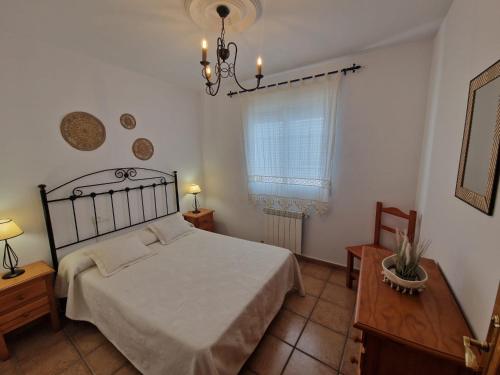 En eller flere senge i et værelse på Apartamento SAN ANTON Cazorla