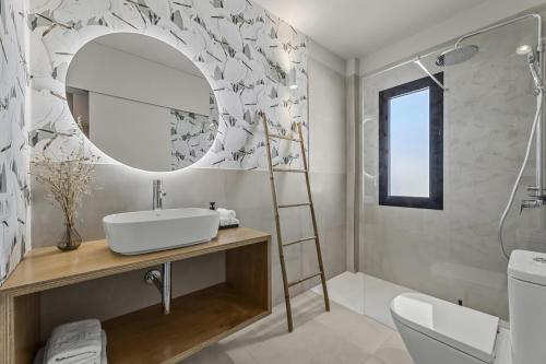 a bathroom with a sink and a mirror at La casa de las velas in Playa Honda