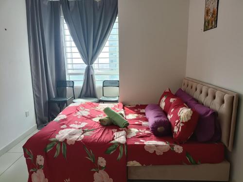 a bed with two teddy bears laying on it at Cikta Homestay at Southville City Savanna Suite in Kampong Tangkas