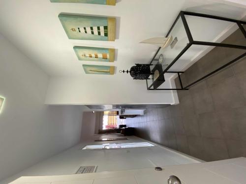 a staircase in a bathroom with a sink and a ceiling at Apartamento cerca del mar in Poris de Abona