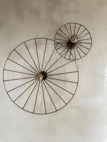 two metal fans hanging from a ceiling at Agapitos Villas & Guesthouses in Agios Ioannis Pelio