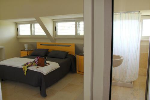 Tempat tidur dalam kamar di Sicilia Bedda B&B