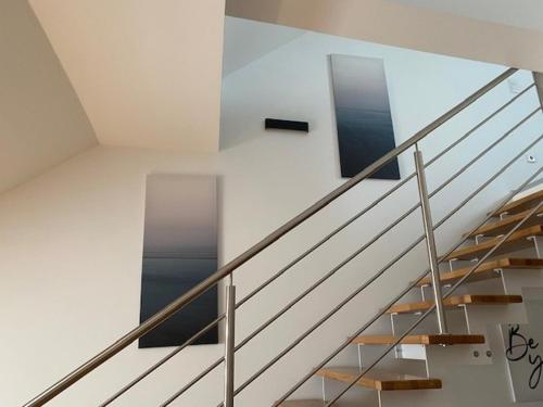 a staircase in a house with a window on the wall at Paky Appartements 00316 in Bruck an der Leitha