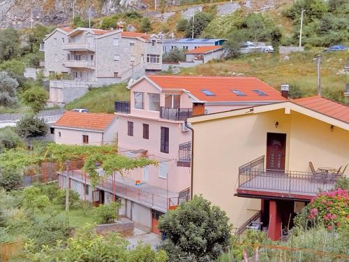a group of houses on a hill at Apartment Dora in Kotor