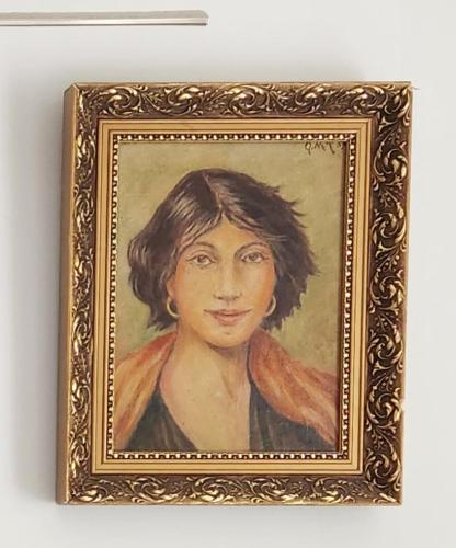 a painting of a woman in a gold frame at HaPPy Inn Ugnė, The studio is in the heart of the old town, self-check-in, car-parking in Vilnius