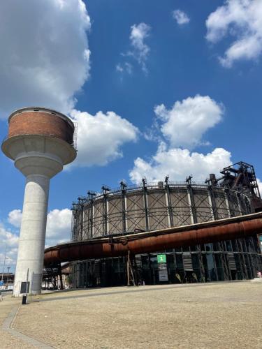 a building with a control tower in front of it at Apartmány Fifejdy, Ostrava, centrum in Ostrava