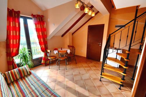 a room with a table and a dining room at Apartments Ivetić in Kotor