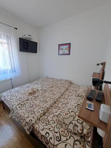 Postel nebo postele na pokoji v ubytování Apartman Helena