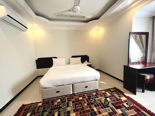 Postel nebo postele na pokoji v ubytování Al Taraf Hotel Apartment