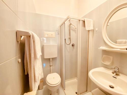 a bathroom with a shower and a toilet and a sink at Locanda Del Boscaiolo in Monasterolo del Castello