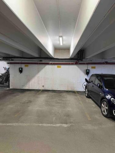 a parking garage with a car parked in it at Nice apartment on Geilotunet, Close to city center in Geilo