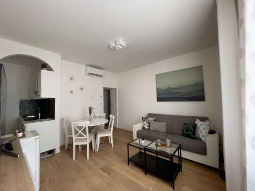 a living room with a couch and a table at acasasiena in Siena