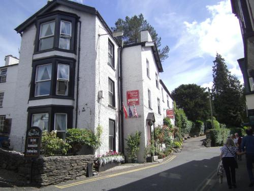 a building with a sign on the side of it at Virginia Cottage Guest House in Bowness-on-Windermere