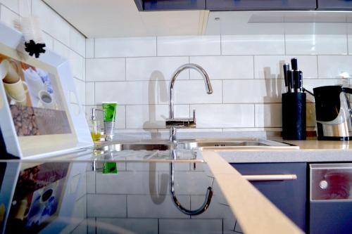 Kuchyň nebo kuchyňský kout v ubytování Wohnung mit Meerblick Romy